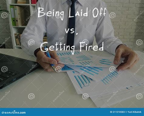 Business Concept Meaning Being Laid Off Vs. Getting Fired with Sign on ...