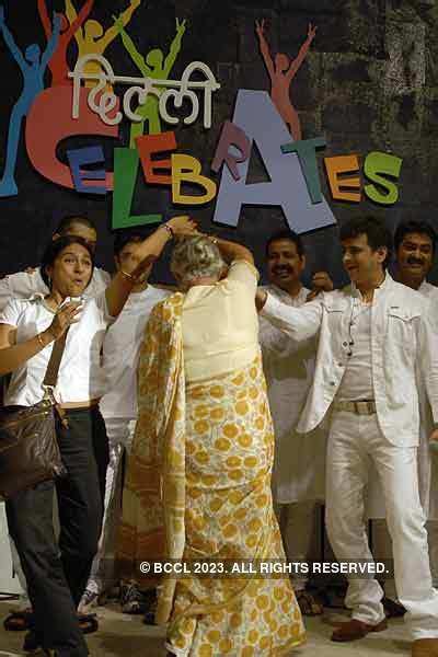 Chief Minister Sheila Dikshit dances with singer Palash Sen (R)at the ...