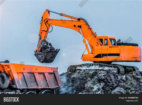 Image result for Large Excavators Loading Trucks