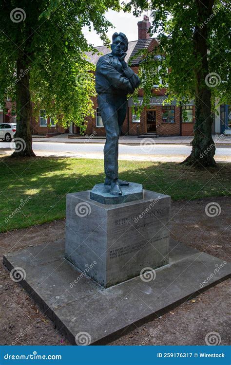 Vertical Shot of the Statue of the Famous WW1 Poet Rupert Brooke in a Park in Rugby, United ...