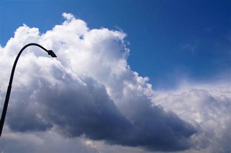 Low angle view of street light against cloudy sky | Premium Photo