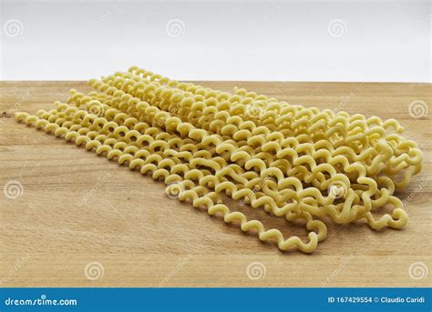 Raw Fusilli Lunghi Bucati. Traditional Italian Pasta on Wooden Table ...
