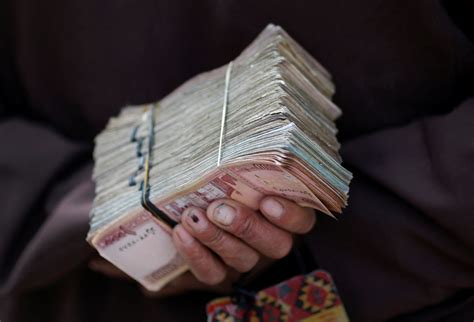 Afghan central bank moves to halt currency slide as crisis deepens ...