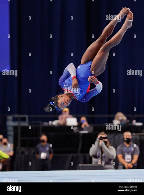 June 25, 2021: Simone Biles twists in the air during her floor routine ...