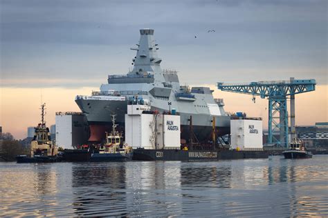 The Royal Navy's first Type 26 Frigate, HMS Glasgow, is moved by barge ...