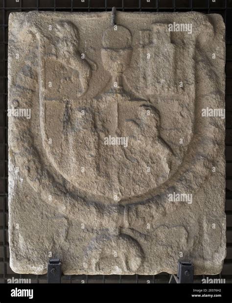 Spanish coat of arms with the arms of the Kingdom of Galicia. From gate of Maestranza wall in La ...