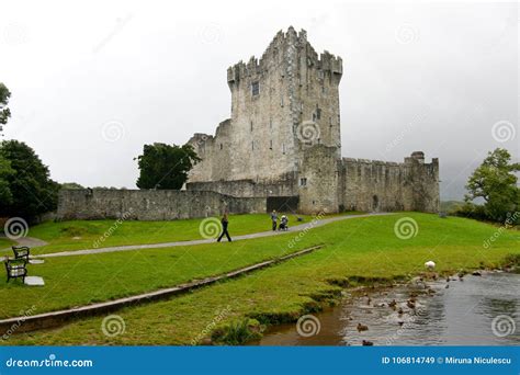 People Walking Around the Ross Castle Ruins in Killarney, Ireland ...