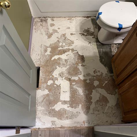How to Remove Floor Tile In An Upstairs Bathroom | DIY