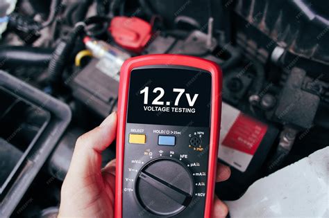 Premium Photo | Car battery voltage testing with a digital multimeter ...