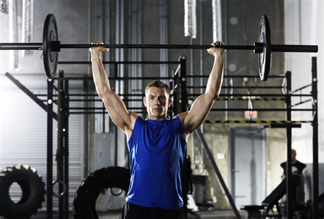 How to Do the Standing Overhead Press With a Barbell