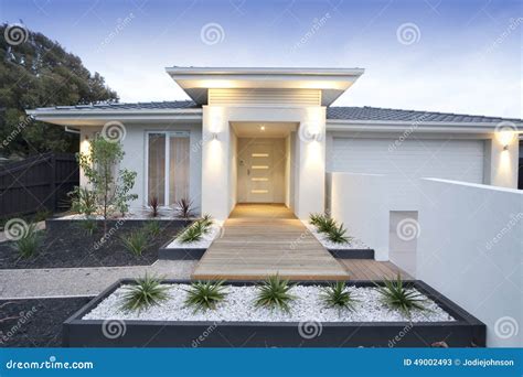 White Contemporary House Exterior Stock Image - Image of lights, fence ...