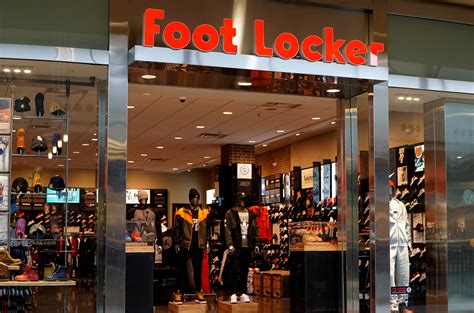 Foot Locker shares plummet on forecast cut, dividend pause; drags peers ...
