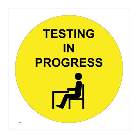 Testing In Progress Sign with Desk Person Sitting On A Chair – PWDirect
