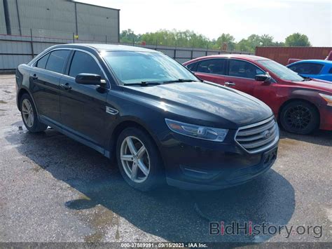 Report 1FAHP2E8XHG132183 FORD TAURUS 2017 Black Flexible Fuel - price and damage history
