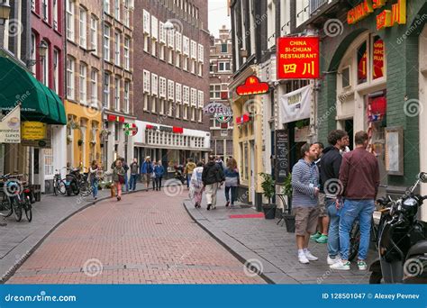 AMSTERDAM, NETHERLANDS - JUNE 25, 2017: Unknown Tourists Walking on One ...