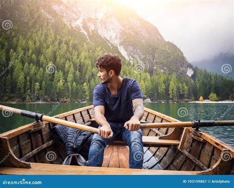Handsome Man Rowing in Boat Stock Image - Image of recreation, dreamer ...
