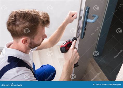 Young Carpenter Install Door Lock Stock Image - Image of house ...