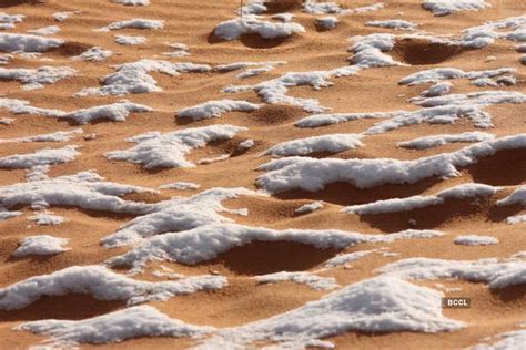 Take a look at the snow-covered sand dunes in the small Saharan Desert ...