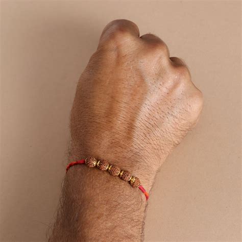 Rudraksha Golden Rakhi – Pratha - Jewellery Studio