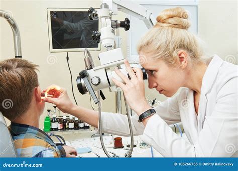Ear, Nose, Throat Examining. ENT Doctor with a Child Patient and Endoscope Stock Image - Image ...