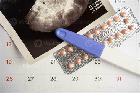 Pregnancy test and birth control pills with ultrasound scan of baby uterus, contraception health ...