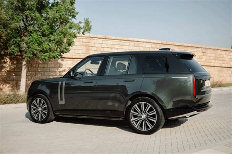 Rent Land Rover Range Rover HSE Green in Dubai - SUV - Octane.Rent