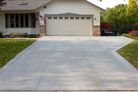 Gray Brushed Concrete Driveway with Decorative White Seamless Stamped ...