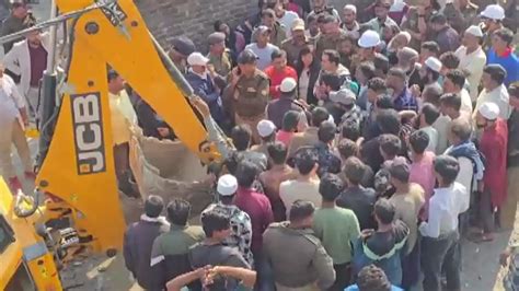 Bulldozer standoff in Dehradun’s village as man climbs rooftop in ...