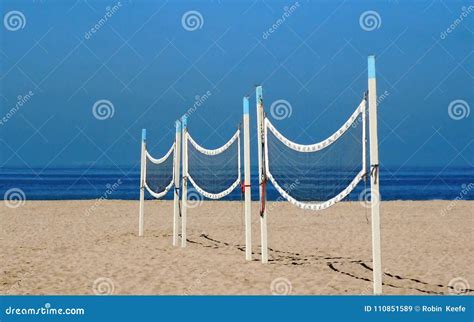 Three Volley Ball Nets are in a Line on an Empty Beach Stock Image ...