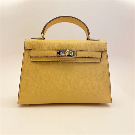 new pochette mini bag/yellow wiz Horse charm/brown | muimui