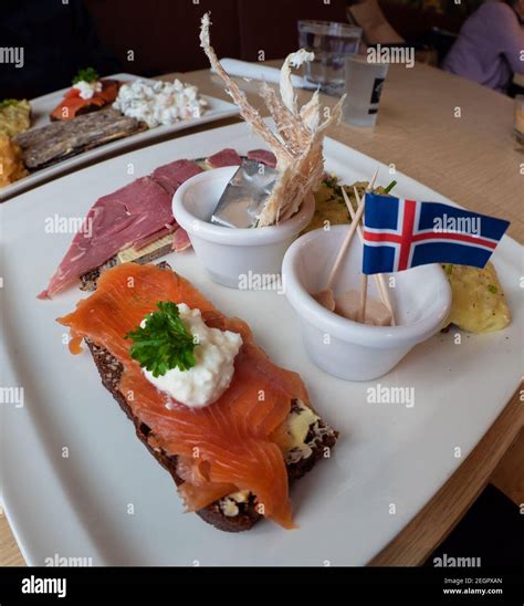 Icelandic food sample platter with fermented shark, dried fish, butter ...
