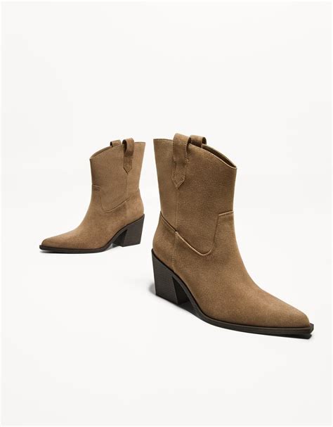 Asymmetric heeled cowboy ankle boots - Women | Bershka