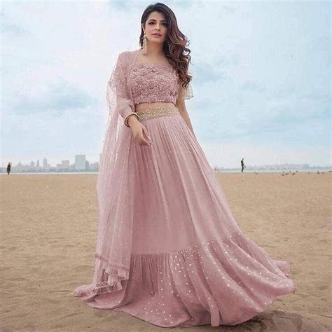 Ruffle Lehenga Choli in Sand Pink Color and Georgette Cloths