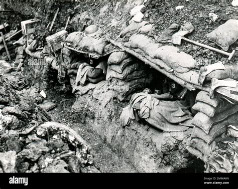 A trench scene during the First World War, with soldiers asleep in ...