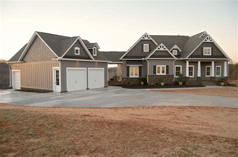 Craftsman style home. Gray with white windows. Stone, Hardi Plank ...