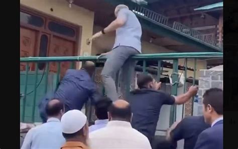 Omar Abdullah scales graveyard gates to offer tributes to martyrs