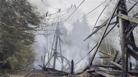 Fire continues to burn historic Washington state railroad bridge ...