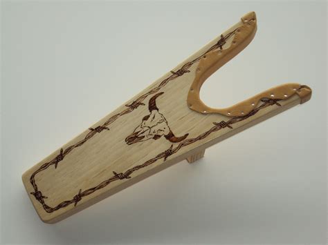 I create these handmade wood and leather Boot Jacks for my shop on ETSY ...