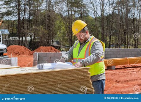 Experienced Build Engineer Safety an Holding in Hands Blueprint Project Doing Monitoring ...