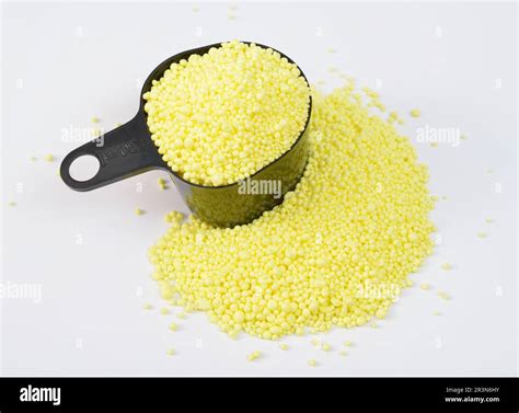 Granulated Sulfur or sulphur on white background Stock Photo - Alamy