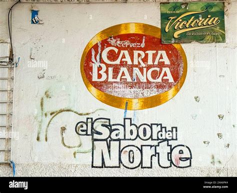 Mexican cantina with the wall painted with the Carta Blanca beer logo ...