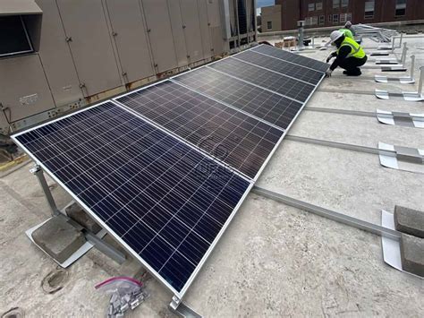 Install Solar Panel Ballast System On A Flat Roof