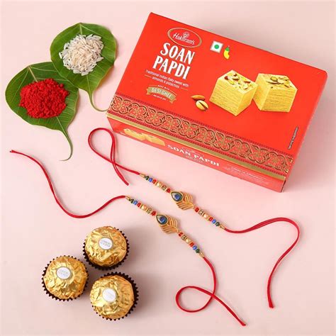 Send Sneh Gold Rakhi With Soan Papdi & Ferrero Rocher Online - RKH22 ...