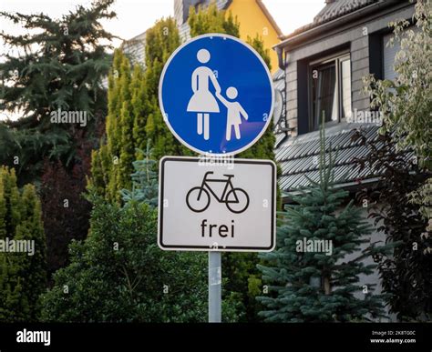 Sidewalk traffic sign for pedestrians. Bicycles are allowed. German ...