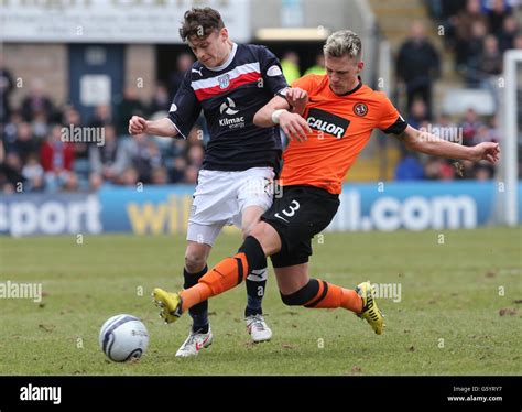 Dundee ***'s Barry Douglas challenges Dundee's Nicholas Riley (left ...