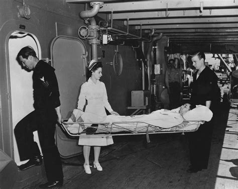 Nurse Watches Wounded Being Brought Aboard Ship – Women of World War II
