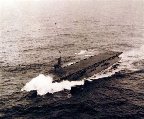 USS Bismarck Sea's (CVE-95) bow digs in to a large wave in heavy seas ...