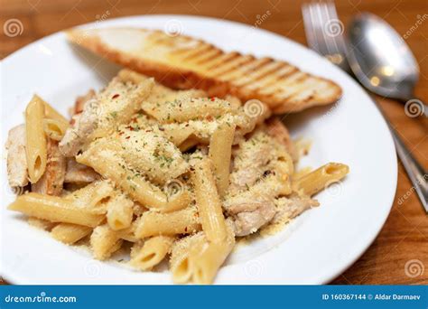 Authentic Italian Creamy Chicken Alfredo Penne Pasta in a Restaurant ...