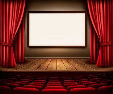 Um palco de teatro com uma cortina vermelha, assentos e uma placa de ...