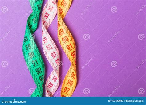 Close Up of Colorful Measure Tapes on Purple Background. Perfect Female Figure Measurements ...